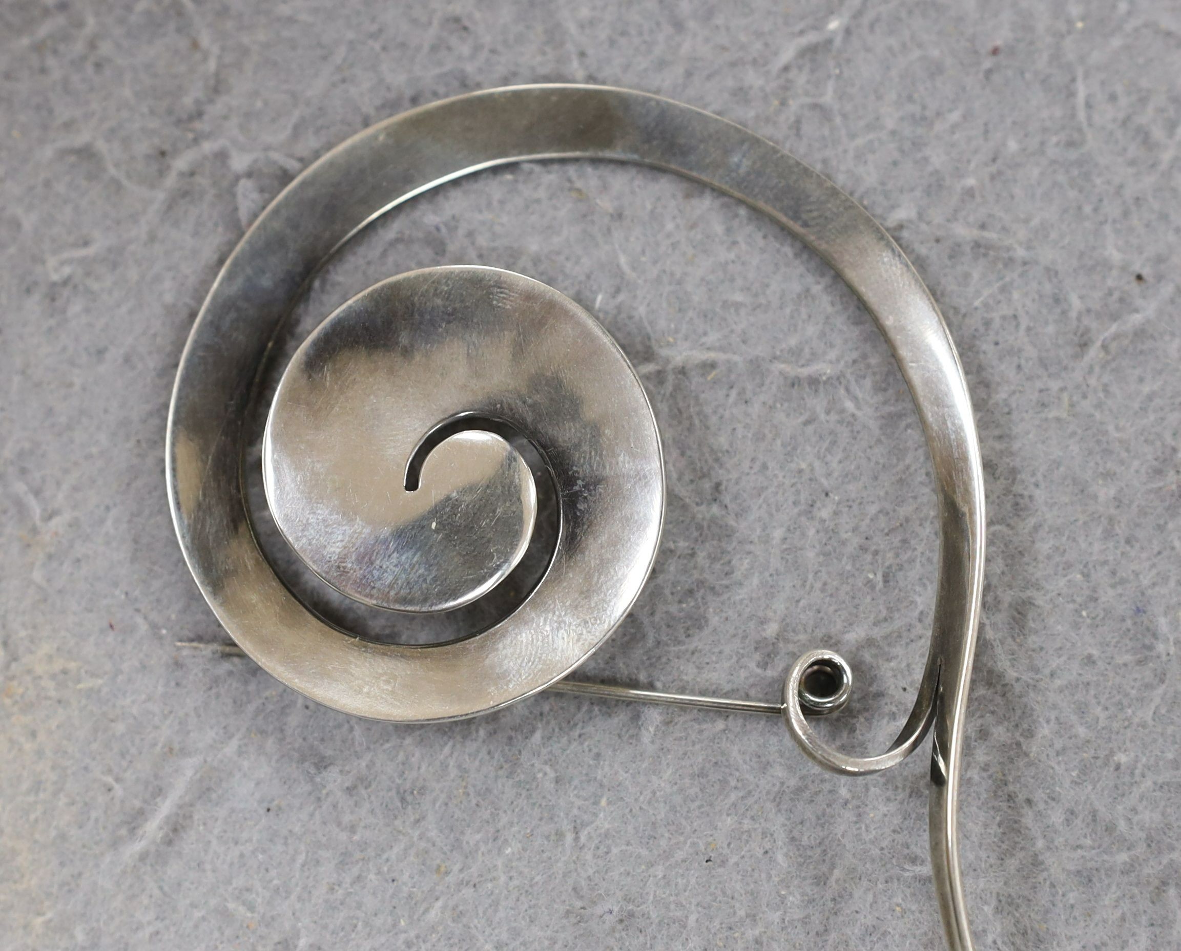 A Vivianna Torun for Georg Jensen sterling silver scroll brooch